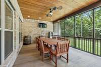 Covered, screened-in back porch with nice finishes.