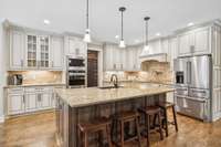 Eat-in kitchen with gorgeous finishes. Perfect for that chef in your family!