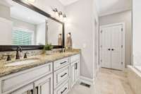 Double vanity master bathroom with large tub and double head shower!