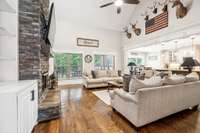 High Ceilings with floor-to-ceiling fireplace and built-in bookshelves.
