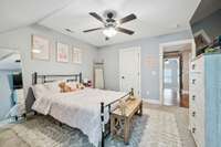 Second bedroom upstairs with walk in closet and built in dresser.