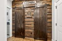 Lovely farmhouse aesthetic pantry with sliding barn doors.