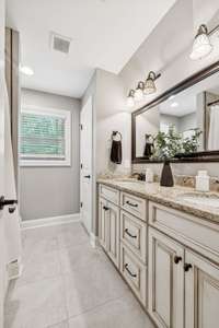 Double vanity full bathroom upstairs.