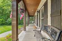 Imagine swinging on this front porch, drinking your coffee every morning! Pure peace and tranquility!