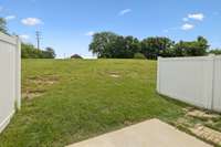 Semi private patio that opens to green space adjacent to church property