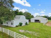 Left - 4 stall barn with wash station (and hot water), electric waterers, and haymow Right - Indoor arena 50x60'