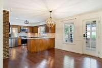Dining area opens to sunroom