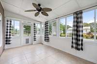 Sunroom off kitchen, overlooks yard and stables
