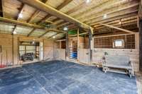 4 stall barn, with wash station in the back (has hot water), additional stall (5) in the back right could be used for pigs