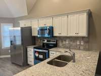 Photo of different home but same floor plan. Finishes will vary.