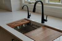 Not only is the sink beautiful, but it is also effortlessly functional. Integrated cutting board and touchless fixtures make prep and clean up a breeze.