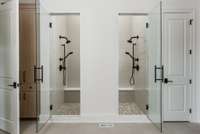 Indulge in the ultimate shower experience with dual shower heads and sleek tilework—designed for both luxury and convenience.