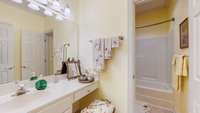 Hall bathroom on upper level with a tub/ shower combo.