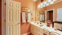 Full bathroom attached to spacious guest room.
