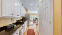 Additional counter space down the hall and a pantry to the right.