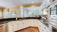 For the chef or chef at heart, the kitchen offers abundant counter space paired with high-end SS appliances.