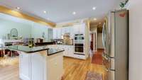 Wonderful size wrap around kitchen island that offers an endless loop from the great room to the breakfast nook.