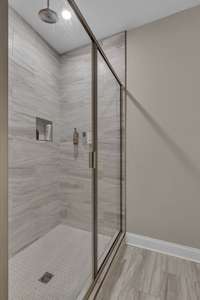 Oversized tile shower with rainfall shower head