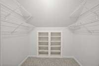 This is the walk in closet upstairs with built in shelves.