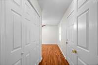 Second bedroom, located on the main floor. This could also be an in-law suite. There is a private entrance from the back deck to this bedroom.  There is also a full bathroom in this room.