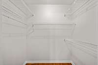 Walk in closet in primary bedroom
