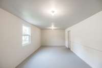 Finished area attached to rear of garage...could be used as office, man cave, workshop, etc