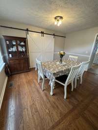 Dining room with hardwood flooring