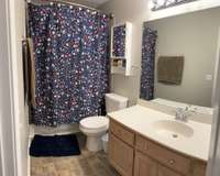 Primary bath with lots of counter space on the vanity.