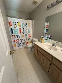 Full bath on the second level with shower/tub combination.