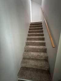 Stairs leading to a separate rec/office area.