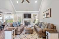 The perfect blend of grandeur and comfort—soak in the natural light and enjoy the coziness of the gas fireplace in this beautiful space