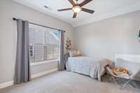 Upstairs bedroom with plenty of space and natural light.