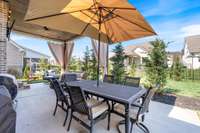 Additional uncovered patio space provides the perfect spot for outdoor dining