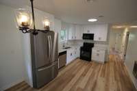 Stainless steel refrigerator and new dishwasher/stove/microwave.