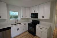 Full length cabinets go all the way up to the ceiling.