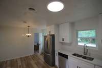 Mud room/utility room with washer/dryer hookups is nice 11x6 and provides convenient access to the back of home.