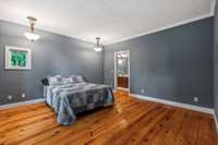 Primary Bedroom located on the Lower Level with an en suite and farmhouse windows