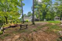 Firepit located in the Backyard with Seating for those cozy nights!  Country Living at it's Best!