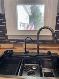 New Modern Kitchen Sink installed below the Farmhouse Window