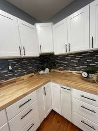 Brand new cabinets, backsplash and countertops