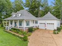 This home features an Aggregate Driveway and an attached 2 Car Garage with lots of storage