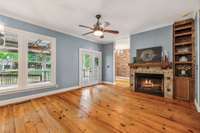 Great Room with a Fireplace for those cozy nights, with a door leading out onto the spacious deck!