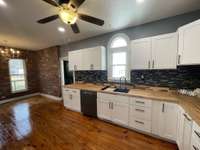 Check out this newly remodeled Kitchen with Brand New Cabinets, Backsplash & Countertops