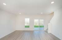 ***Photo from another townhouse recently completed in community with same finishes***

The Great Room is the perfect space for relaxing with family and friends to watch a movie.