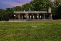 This peaceful retreat in the country offers large covered porch great for entertaining or simply relaxing after a hard days work.