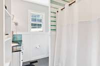 Primary bath. Granite countertops. Tile floors.