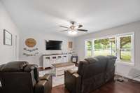 Spacious great room with sunny windows