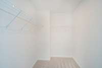 ***Photo is from a previously completed Hampton home in the community***  Owner's Walk-In Closet