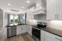 Custom hood range and stainless steel appliances