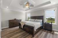 Large primary suite facing the back of the expansive private lot